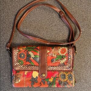 The Sak. Sakroots crossbody with detachable strap.